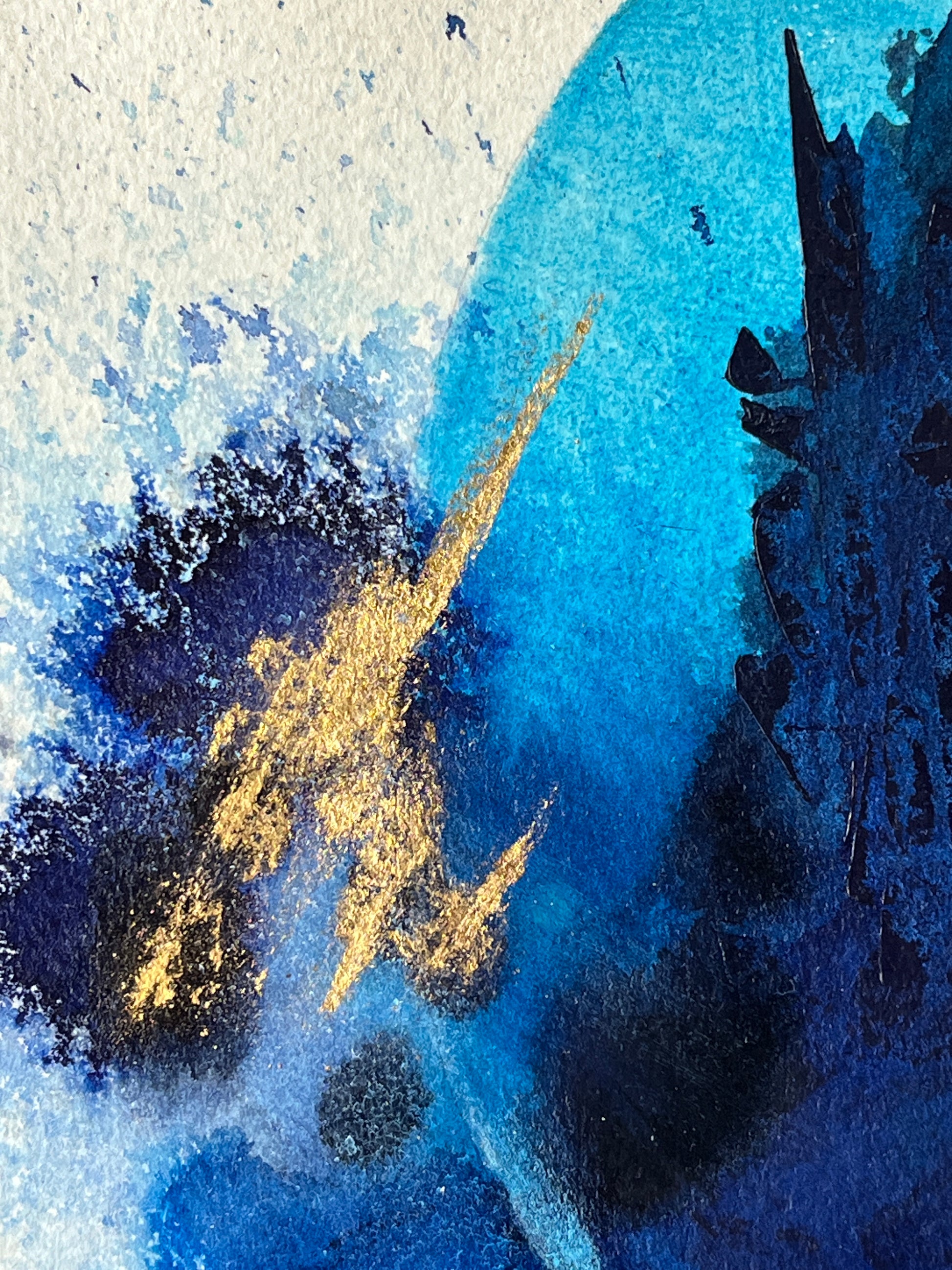 A close-up of an abstract painting with blue tones, textured layers and gold leaf.